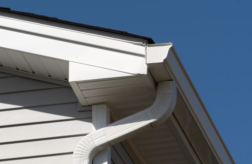 colonial white gutter guard system, fascia, drip edge, soffit providing ventilation to the attic roof line